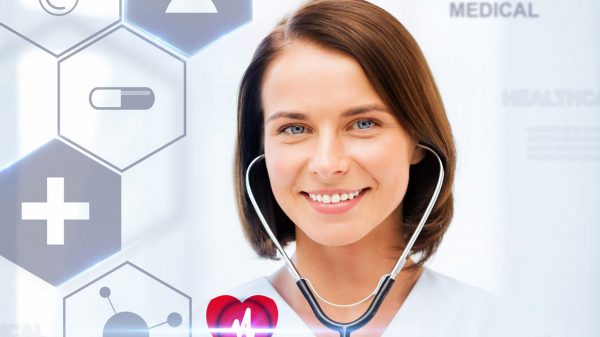 Photo of a smiling female doctor with stethoscope in ears